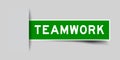 Inserted green sticker label with word teamwork on gray background