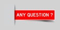 Inserted red label sticker with word any question on gray background