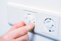 Inserting Baby Safety Plugs Into Wall Socket To Prevent Danger At Home Royalty Free Stock Photo