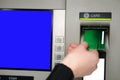 Inserting plastic card visa into ATM