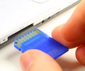 Inserting SD card Royalty Free Stock Photo