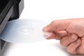 Inserting a transparent CD / DVD into a player. Hand insert Royalty Free Stock Photo