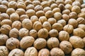 Inshell walnuts background. View from above. Royalty Free Stock Photo