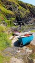 Inshore fishing boats on stone jetty Royalty Free Stock Photo