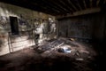 Inside an abandoned WWII concrete casemate with graffiti and the skeleton of a metallic bed on the French Atlantic coast