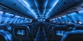 The inside of an airplane is lit up with blue lights Royalty Free Stock Photo