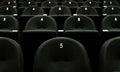 Inside of auditorium movie theatre with seats and numbers.