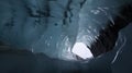 Inside a Blue Glacial Ice Cave in The Glacier Background Royalty Free Stock Photo