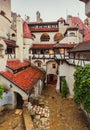 Inside Bran Castle in Transylvania. Inner yard in a summer rainy day. The dark Castle of Count Dracula Brasov, Romania Royalty Free Stock Photo