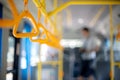 inside the bus yellow hand grip for the passenger to hold Royalty Free Stock Photo