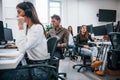 Inside of call center. Young business people working together in the modern office Royalty Free Stock Photo