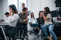 Inside of call center. Young business people working together in the modern office Royalty Free Stock Photo