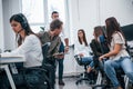 Inside of call center. Young business people working together in the modern office Royalty Free Stock Photo