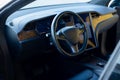 Inside car interior with front seats, textile, windows, door, console. Electric car interior details. Modern and