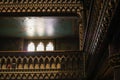 Inside the Catholic church is an altar with icons and lamps. organ, ancient decoration, Gothic, stained glass windows, columns. Royalty Free Stock Photo