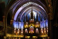 Inside the Catholic church is an altar with icons and lamps. organ, ancient decoration, Gothic, stained glass windows, columns. Royalty Free Stock Photo