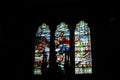 Inside the Catholic church window with icons and lamps. ancient decoration, Gothic, stained glass windows, columns.