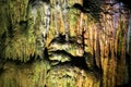 Inside the cave, the wet colored wall background.