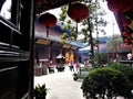 Inside a Chinese temple, hanging red lanterns and religion