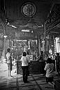 Inside of Chinese temple with a prayers.
