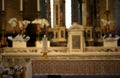 Inside a church with the altar and candle lit Royalty Free Stock Photo