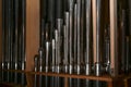 Inside a church organ, register with reed pipes from metal with tuning wire and resonator, musical instrument Royalty Free Stock Photo