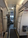 Inside of a commercial plane. Front view of the pilots in a cockpit and cabin Royalty Free Stock Photo