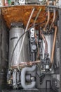 The inside of a condensing boiler completely devastated by rust and limescale, due to the hardness of the water Royalty Free Stock Photo
