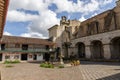 Inside a courtyard of a church in the north of Peru with a fountain and a bell Royalty Free Stock Photo