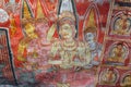 Inside of Dambulla cave temple. Color image of Buddha on the wall