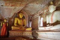 Inside of Dambulla cave temple. Statues of Buddha in ancient stone temple