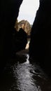 Inside a Cave with Daylight Exit, Ocean View, and Mysterious Reflection Royalty Free Stock Photo
