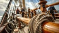 Inside the deck of a ship a group of sailors are hard at work adjusting the rigging and ropes to catch the wind just Royalty Free Stock Photo