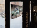 Inside of a derelict industrial building in winter with graffiti