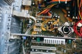 Inside details of the old personal computer. Cooler, motherboard, wires and video card in the dust. Broken PC Royalty Free Stock Photo