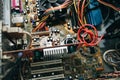 Inside details of the old personal computer. Cooler, motherboard, wires and video card in the dust. Broken PC Royalty Free Stock Photo