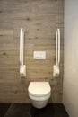 Inside disable toilet. toilet with grab bars for senior or a handicapped person,disable concept. modern design Royalty Free Stock Photo