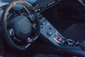 Inside driver seat of super car with steering wheel and modern features on dashboard Royalty Free Stock Photo