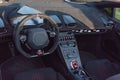 Inside driver seat of super car with steering wheel and modern features on dashboard Royalty Free Stock Photo