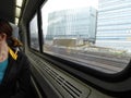 Inside of an express train. Blurred view on modern buildings from high speed train window Royalty Free Stock Photo