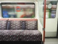 Interior of a 1972 Bakerloo line underground train showing the vintage seating and design