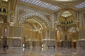 Inside of famous White Grand Sheikh Zayed Mosque - marbled golden columns and archs with arabic ornament