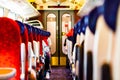 Inside the fast metro train. Focus on a seats. Shallow focus with blurred background. Royalty Free Stock Photo