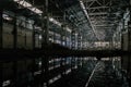 Inside of flooded dirty abandoned ruined industrial building with water reflection