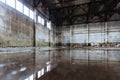 Inside of flooded dirty abandoned ruined industrial building with water reflection