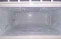 Inside the freezer of a refrigerator water vapor frozen on its walls / empty space in freeze Royalty Free Stock Photo