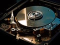 The inside of a hard drive with its spinning platters and read/write heads visible created with Generative AI Royalty Free Stock Photo