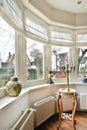 a living room with a large window and a table