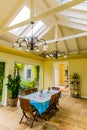 Inside interior of dining room with skylight conservatory roof in up-market house in the suburbs