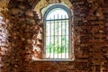 Inside interior of an old abandoned church in Latvia, Galgauska, window arches and a old brick wall Royalty Free Stock Photo